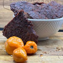 Load image into Gallery viewer, Jerky in a bowl with habanero peppers near
