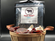 Load image into Gallery viewer, A basket of Garlic beef jerky with a bag of it