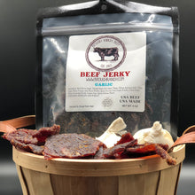 Load image into Gallery viewer, A basket of Garlic beef jerky with a bag of it