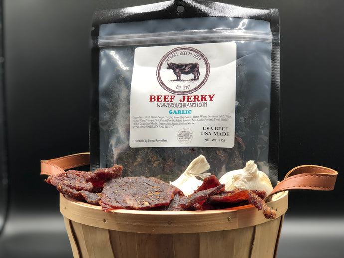 A basket of Garlic beef jerky with a bag of it